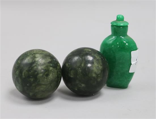 A jade snuff bottle and two balls